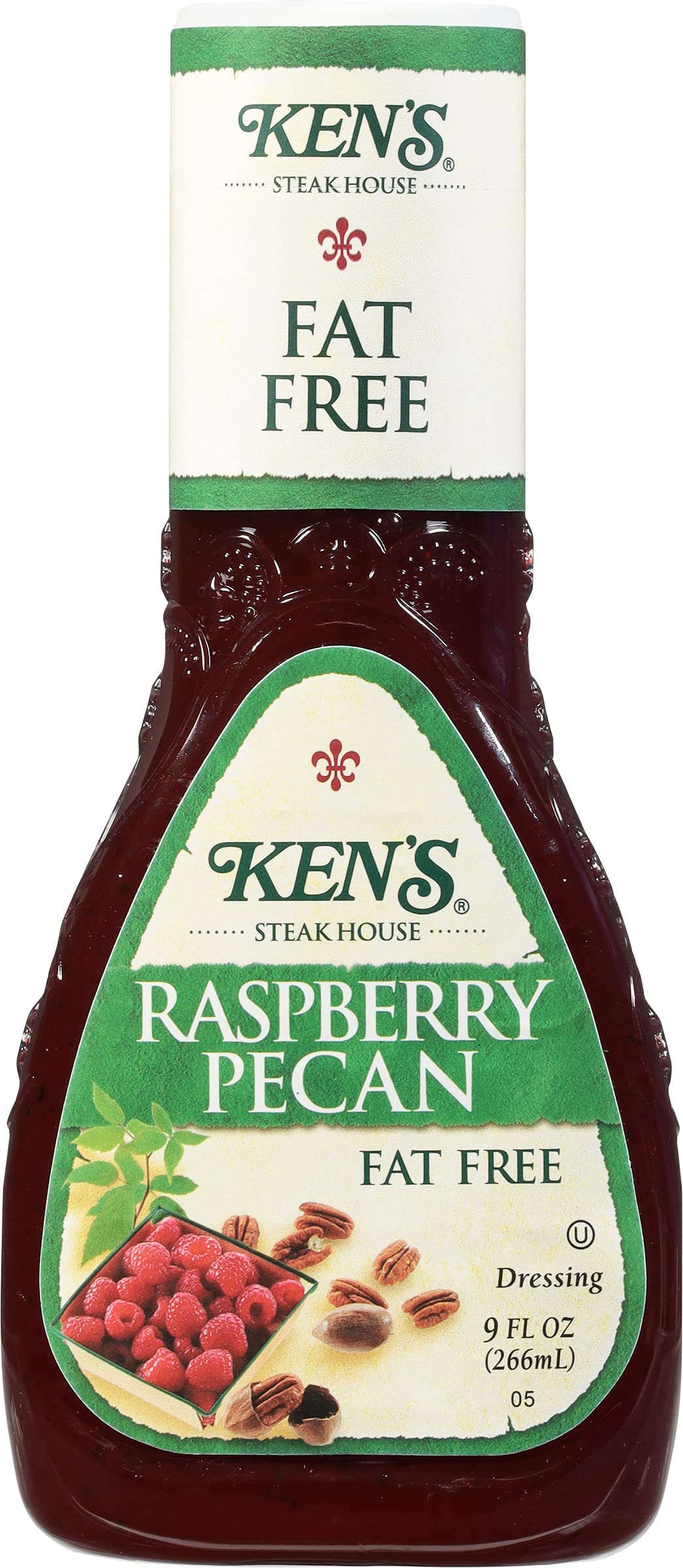 Ken's Raspberry-Pecan Dressing being poured over greens for tangy-sweet flavor