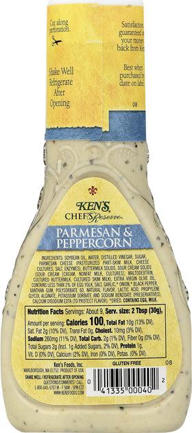 Pouring Ken's Steak House dressing to reveal creamy texture and aroma