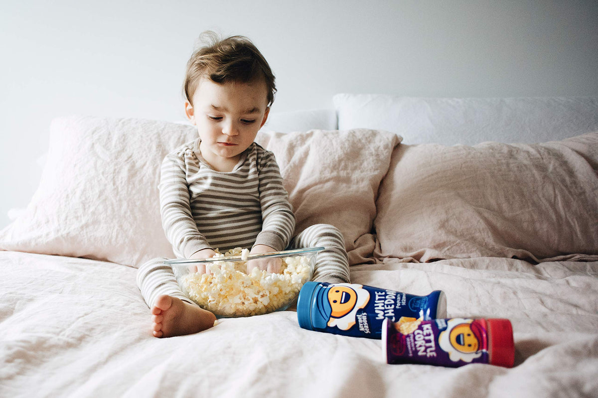 Kernel Season's kettle corn seasoning in use during a cozy kitchen moment