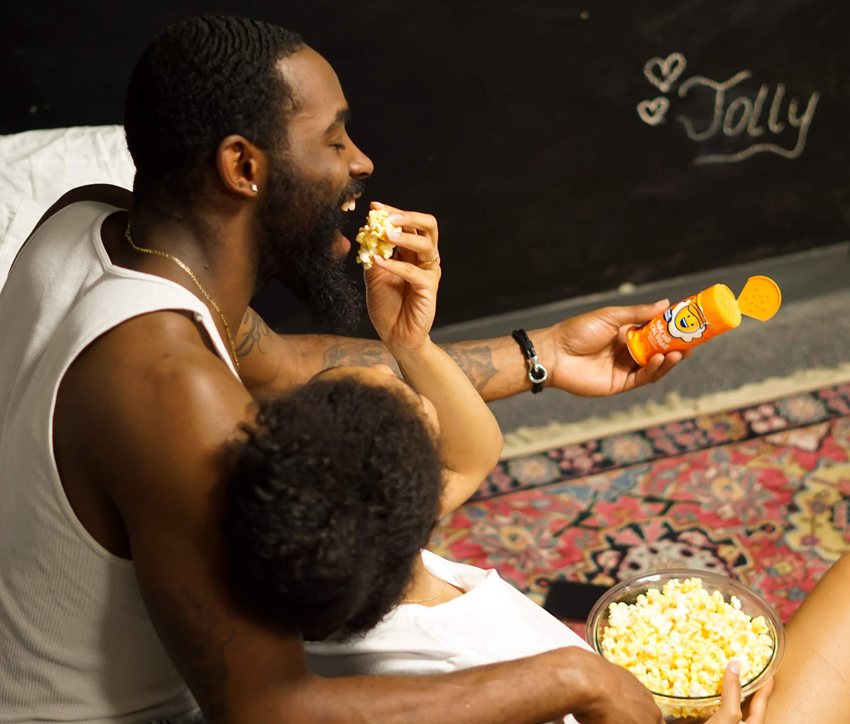 Kitchen counter setup with Kernel Season's seasoning and popcorn snack scene.