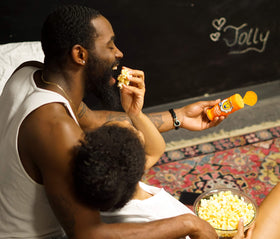 Kitchen counter setup with Kernel Season's seasoning and popcorn snack scene.
