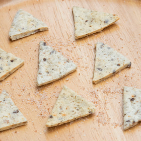 Keto Naturals Sea Salt crackers beside dipping sauce, ideal for quick keto bites.