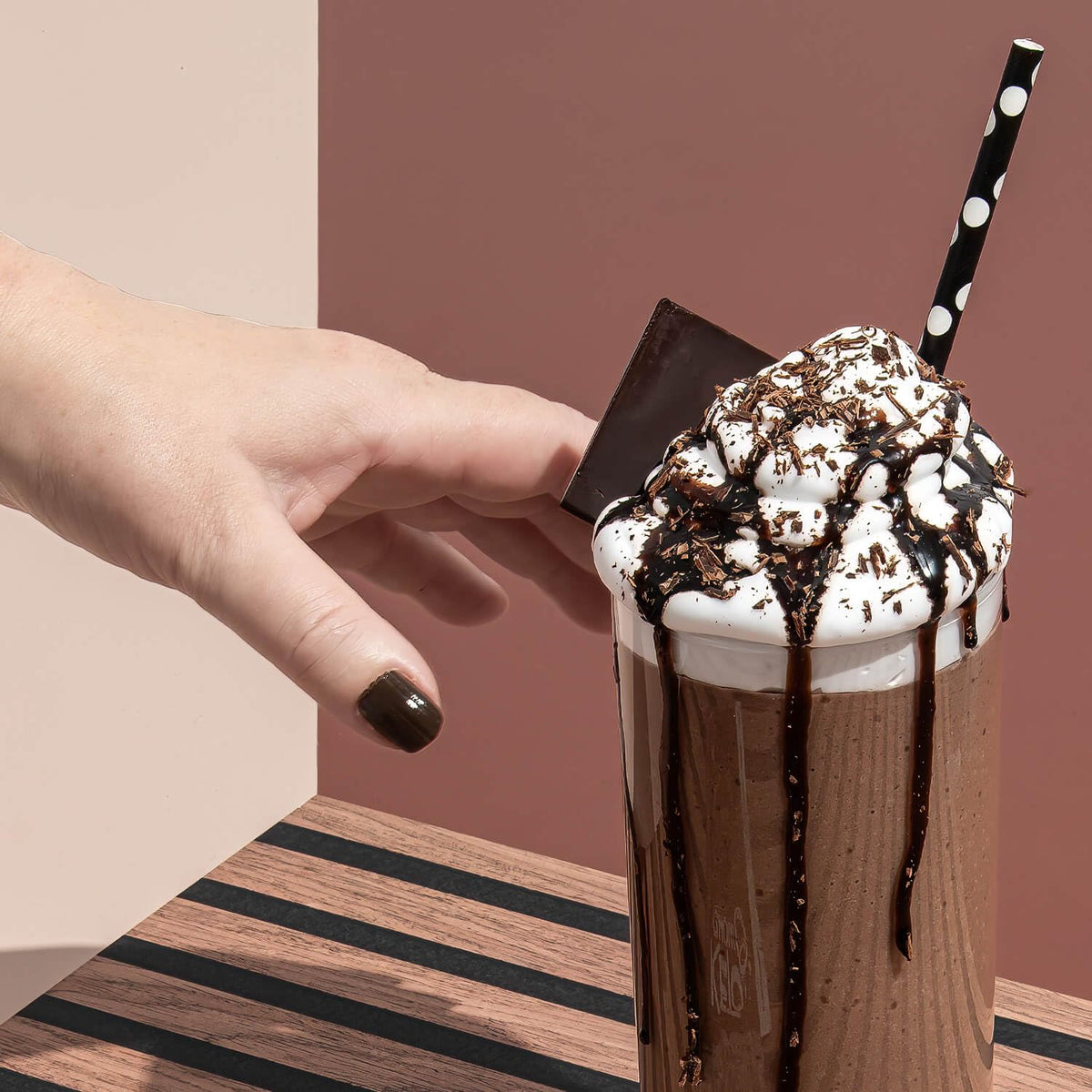 Pouring Keto Chow Chocolate shake for a convenient keto lunch