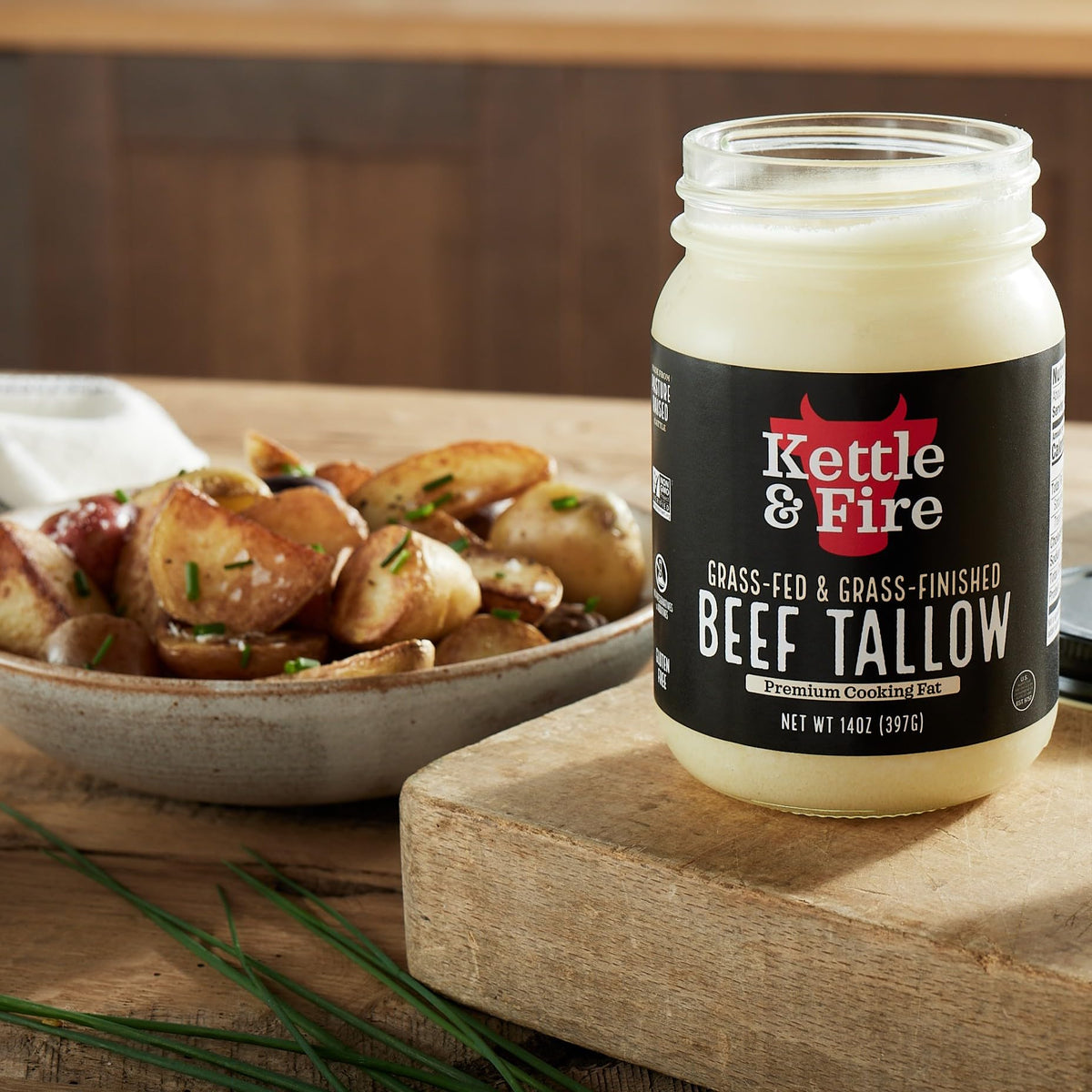 Kettle & Fire beef tallow glass jar on counter, grass-fed sourcing.