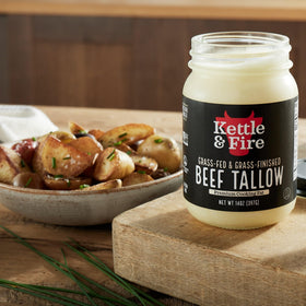 Kettle & Fire beef tallow glass jar on counter, grass-fed sourcing.