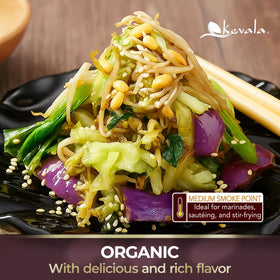 Drizzling Kevala toasted sesame oil over a salad for finish.