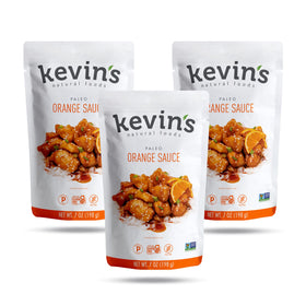 Kevins Natural Foods Orange Sauce bottle pour enhances quick stir-fry flavor