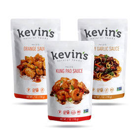 Kevin's Natural Foods Orange simmer sauce bottle for quick, flavorful stir-fry