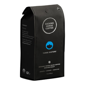 Kicking Horse Three Sisters whole bean coffee bag with balanced flavor.