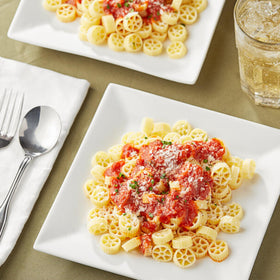 Closeup of KIDU Barilla Mini Wheels pasta texture ready for sauce.
