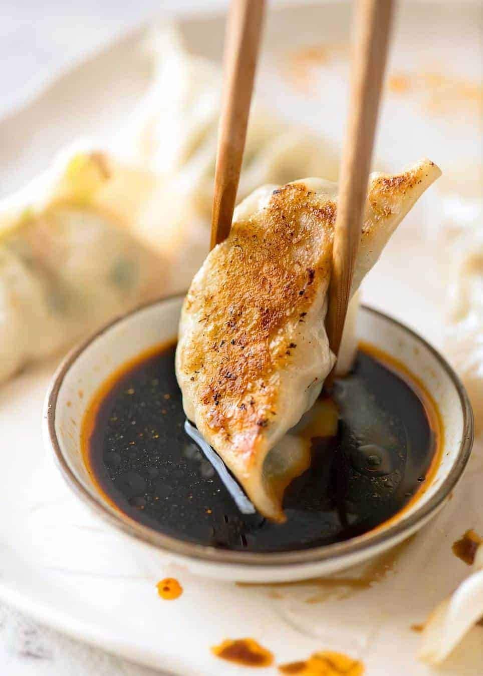 Kikkoman Gyoza Dipping Sauce with dumplings plated elevates flavor with a balanced soy glaze