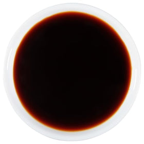 Kikkoman Less Sodium Soy Sauce dipping setup with sauce and dish for dipping use.