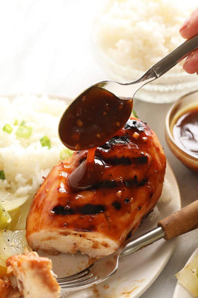 Kosher-certified Kikkoman Less Sodium Teriyaki Sauce labeled for compatibility