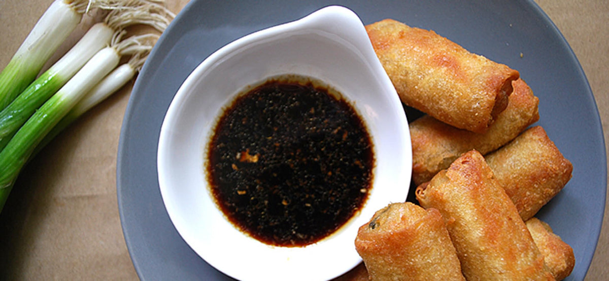 Dipping vegetables in Kikkoman Lite Soy Sauce for a light glaze