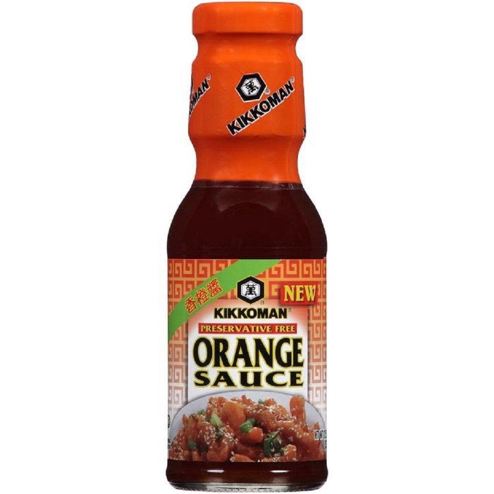 Kikkoman Orange Sauce bottle pour showing a tangy glaze for wings and stir-fry