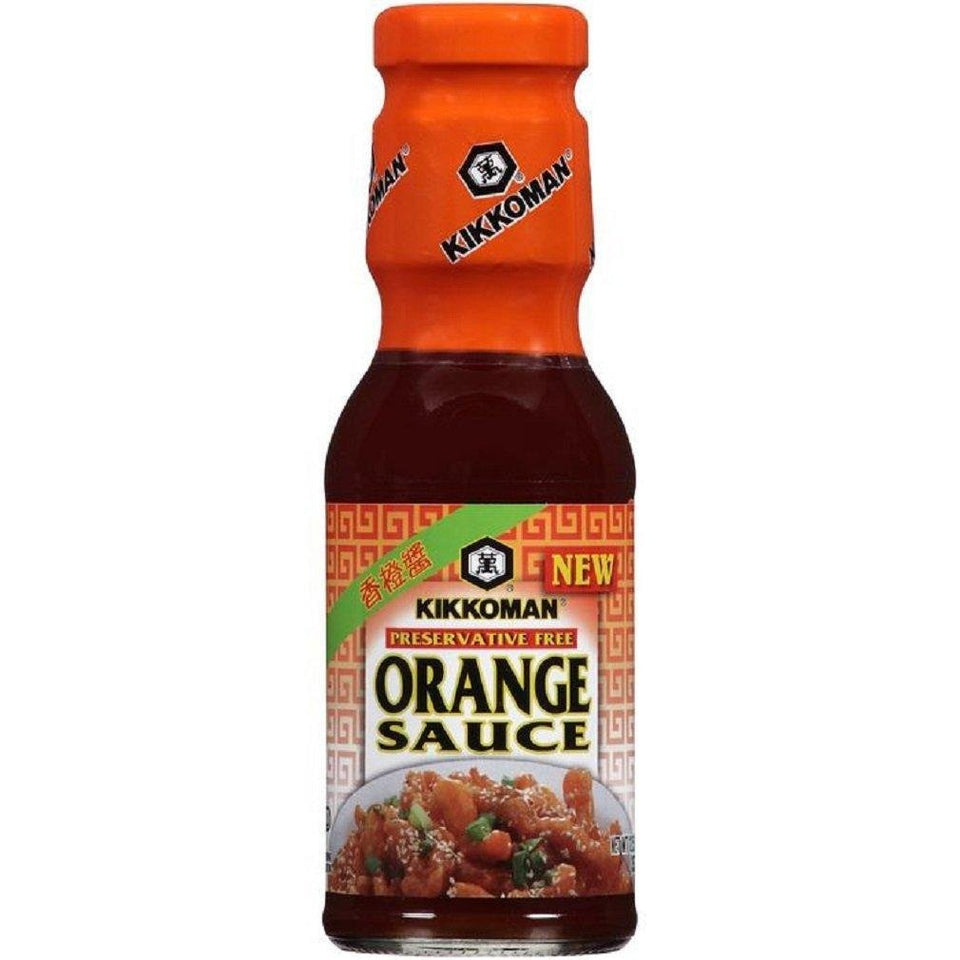 Kikkoman Orange Sauce bottle pour showing a tangy glaze for wings and stir-fry