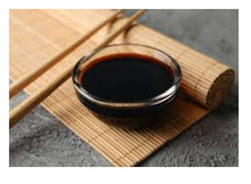 Kikkoman sauce in dipping bowl with ingredients for marinating