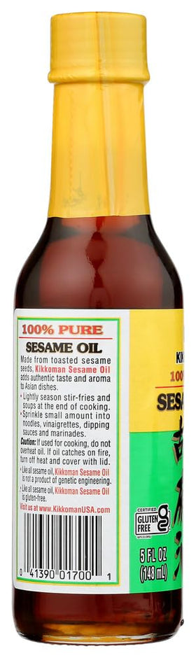 Pour shot of Kikkoman sesame oil for high flavor in sauces and wok cooking.