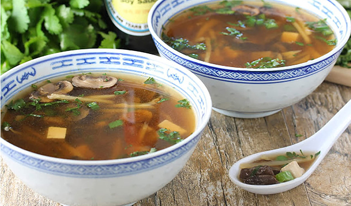 Close up of Kikkoman broth in a bowl with tangy aroma.