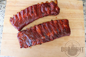 Killer Hogs BBQ Sauce pouring action, ideal for grilling and dipping.