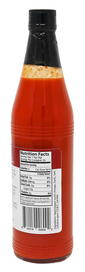 Killer Hogs hot sauce pour closeup showing smooth texture and garlic kick