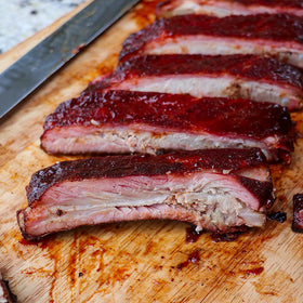 Killer Hogs hot sauce with steak night highlighting robust heat