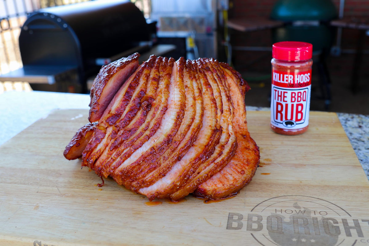 Killer Hogs The BBQ Rub on grill for even coating and color