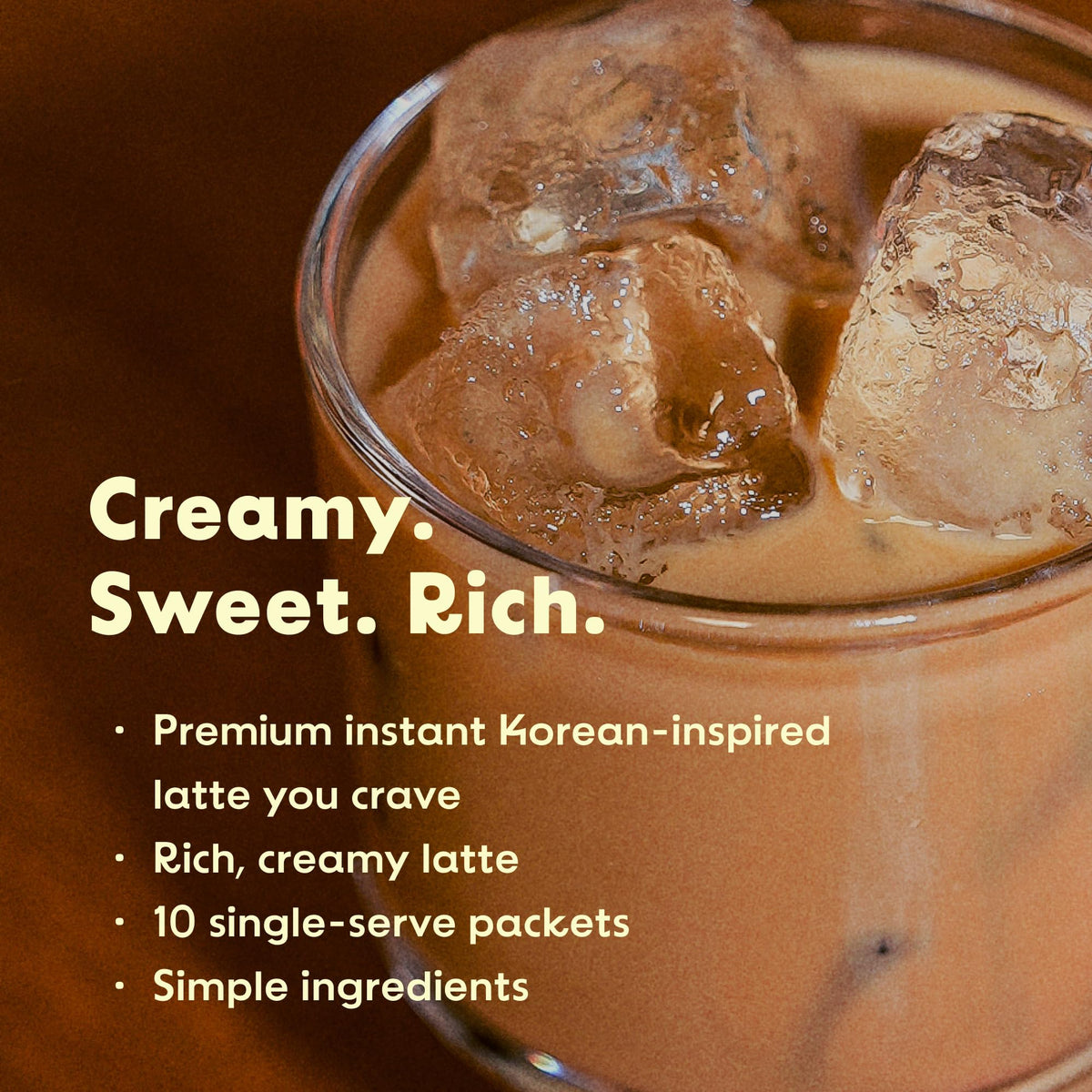 KimlyParc iced latte served in glass, refreshing vegan flavor on warmer days.