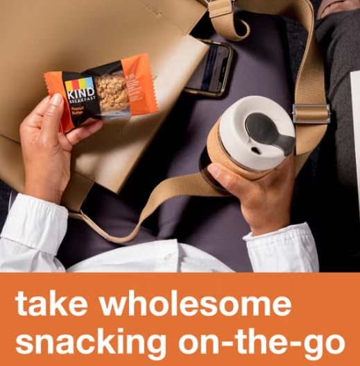 Kind Breakfast Bars stacked beside gym bag imply post-workout energy support.