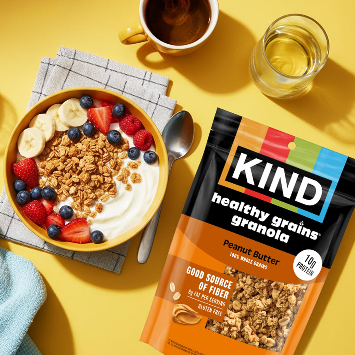 Yogurt bowl topped with KIND Peanut Butter Clusters for extra crunch