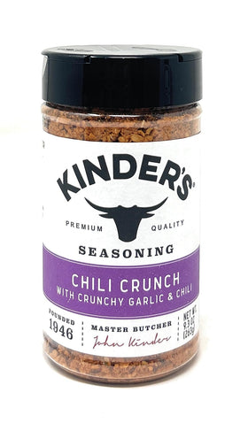 Kinder's Chili Crunch bottle with dual lid for easy measuring, perfect on eggs.