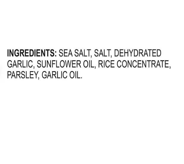 Kinder's Garlic Salt shaker on counter releasing savory aroma while cooking.