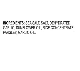 Kinder's Garlic Salt shaker on counter releasing savory aroma while cooking.