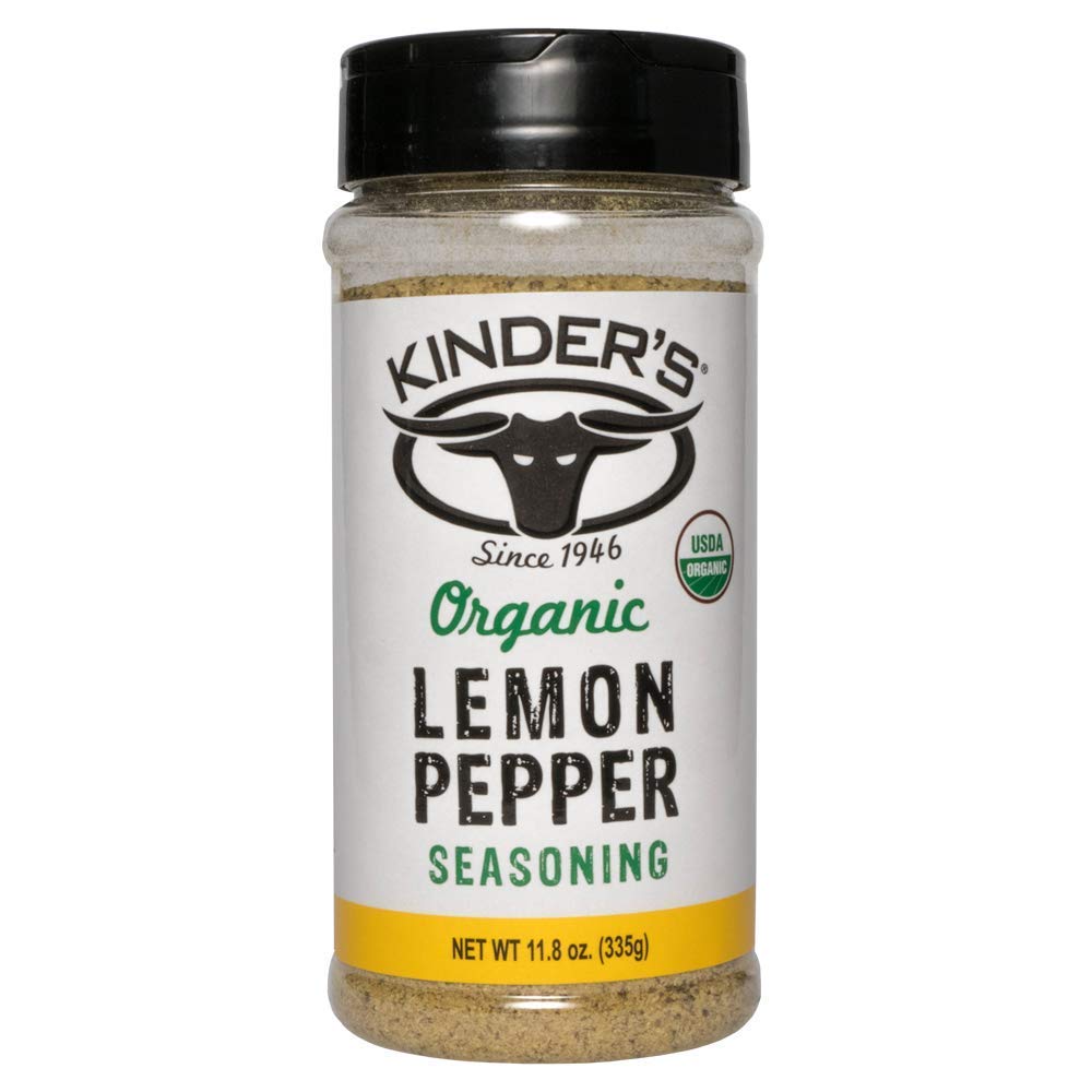 Kinders Organic Lemon Pepper Seasoning bottle on counter for versatile seasoning of chicken, fish, and vegetables.