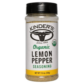 Kinders Organic Lemon Pepper Seasoning bottle on counter for versatile seasoning of chicken, fish, and vegetables.
