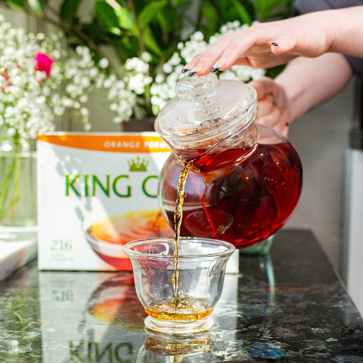 King Cole orange pekoe tea bags steeping cup reveals amber, bright brew