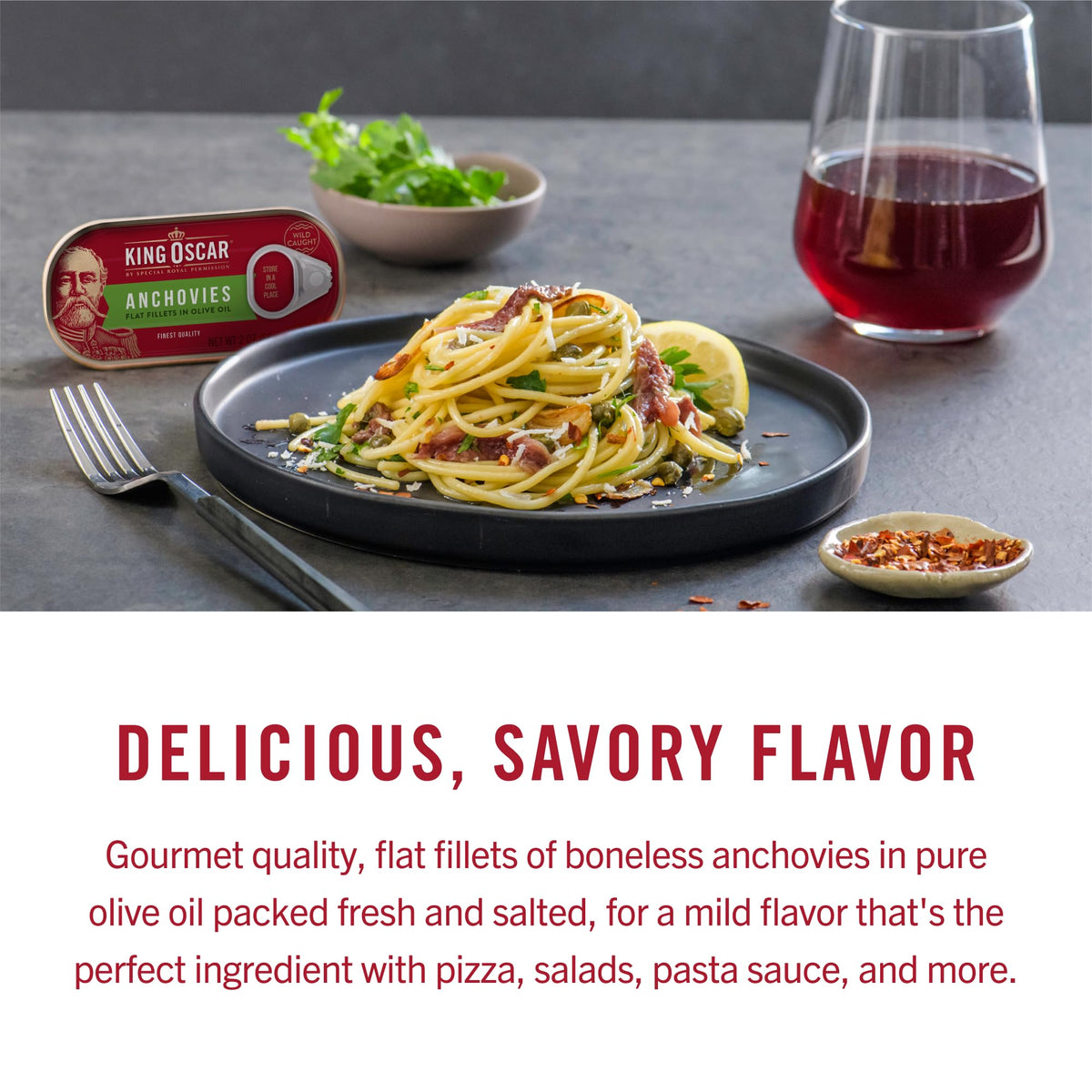 King Oscar anchovies on salad bowl demonstrates protein boost and flavor.