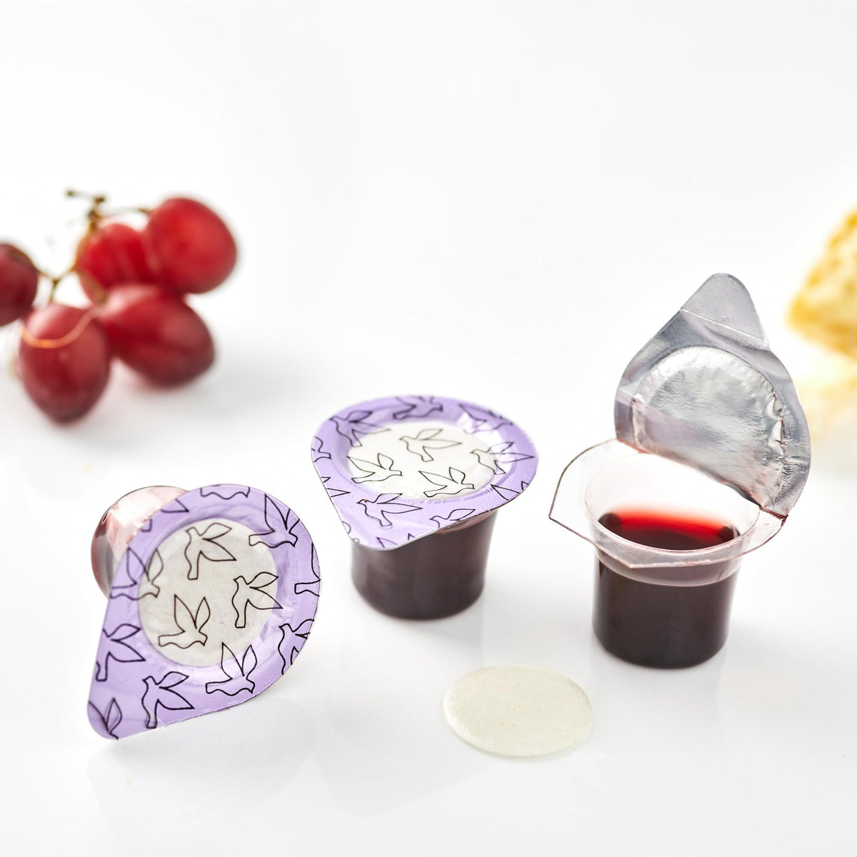 Kingdom prefilled cups reveal red juice and wafer for immediate service.