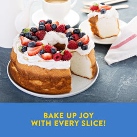 Finished cake topped with berries using Kinnikinnick gluten-free mix