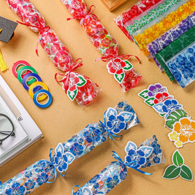 Kisston ribbon spools in multiple colors for lei assembly.