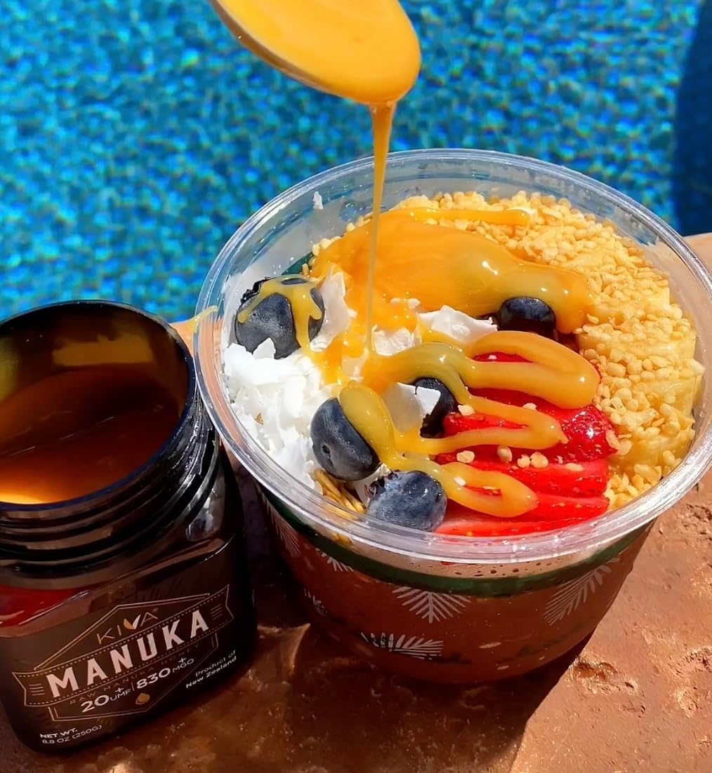 Kiva Manuka Honey jar pouring, smooth stream ideal for toast and smoothies.