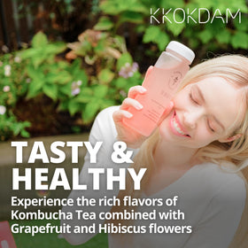 Pouring KKOKDAM Grapefruit Hibiscus kombucha into a glass for a cooling drink