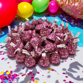 Bright rainbow sprinkles accent on a brownie kiss for celebrations.