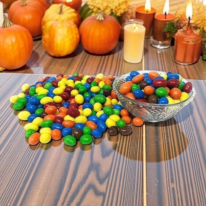 Open resealable KLUB BULK bag showing chocolate-coated peanut MM bites being poured