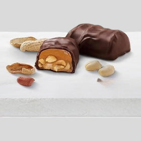 Close-up of peanut caramel nougat pieces with chewy texture and creamy caramel