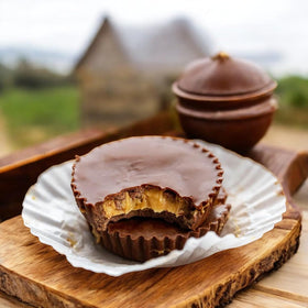 KLUB BULK Sugar Free Dark Chocolate Peanut Butter Cup Delight cross-section reveals rich center.