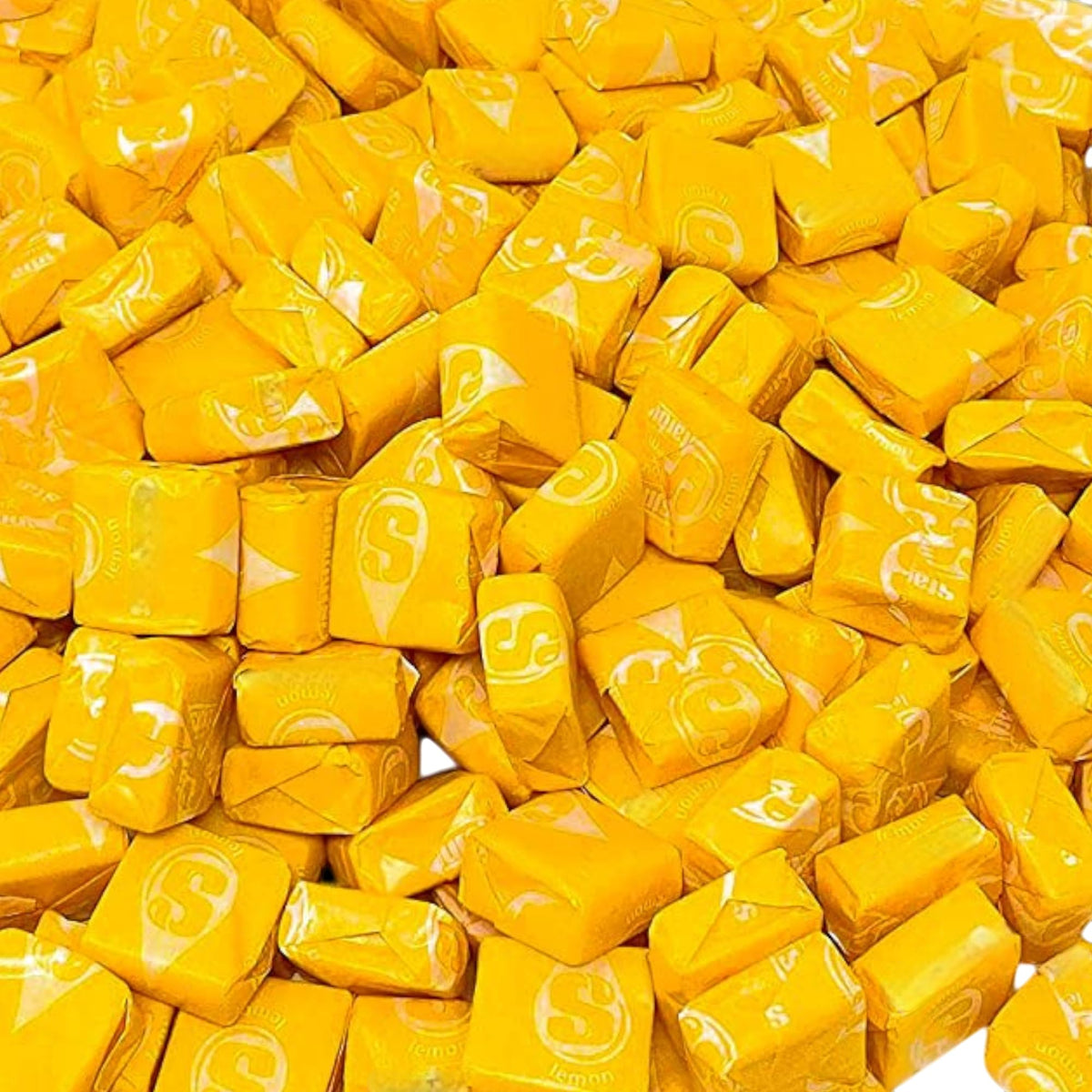 KLUB BULK yellow lemon str burst candies close-up highlights vibrant citrus flavor.