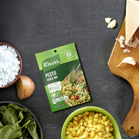 Knorr Pesto Sauce Mix with garlic, parmesan and basil ingredients enhancing meals.
