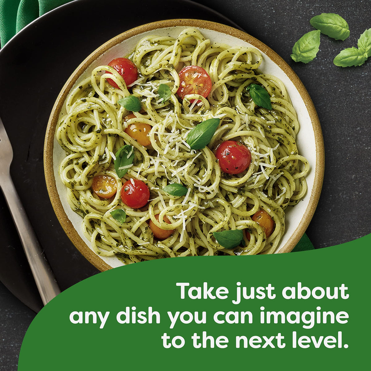 Parmesan shavings atop pesto pasta enhanced by Knorr mix.