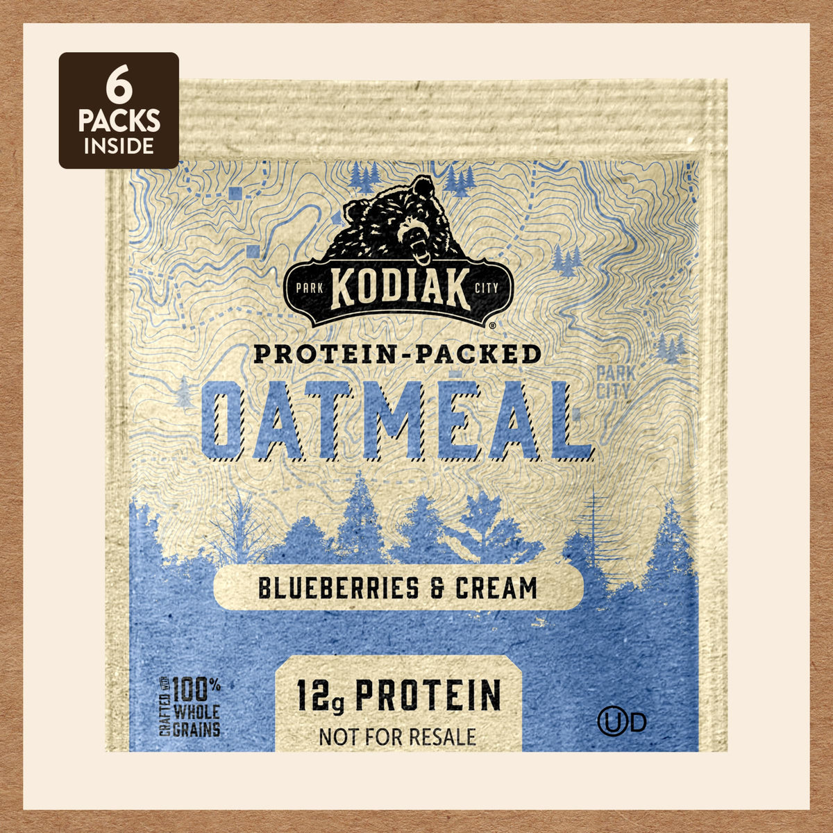 Close-up spoonful of Kodiak Cakes oatmeal with blueberries and cream